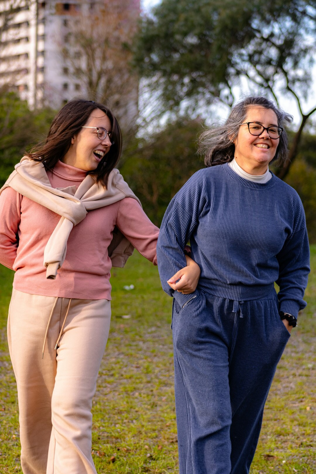 Group of smiling Swiss seniors laughing together in a sunny park