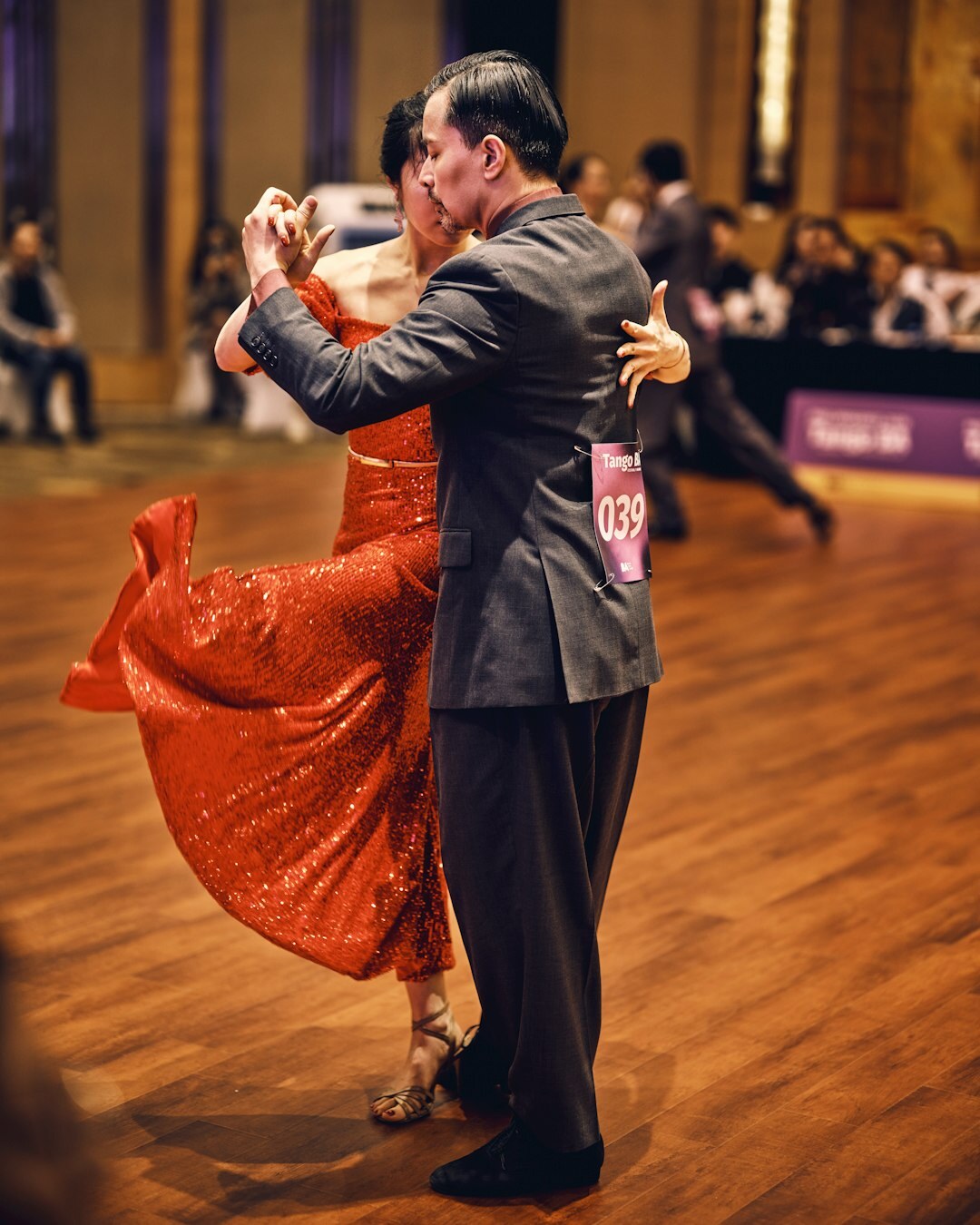 Senior couples dancing together in a community hall